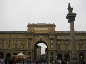A view of Piazza della Repubblica.  There is a carousel that lights up at night on the bottom left.
