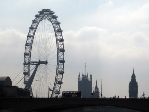 Silhouette of the London Eye on the left and Big Ben to the far right.